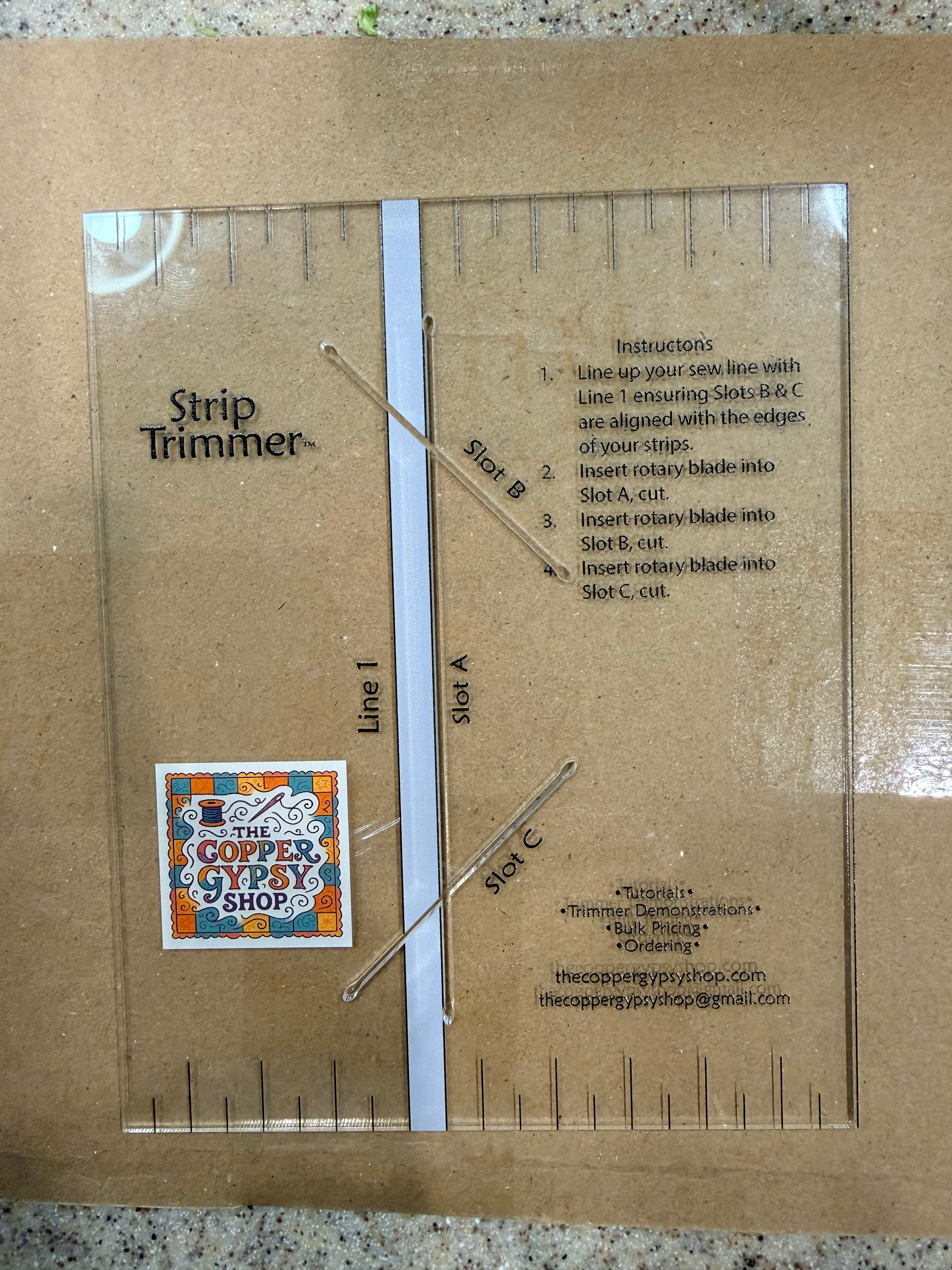 Clear acrylic Strip Trimmer template on kraft backing